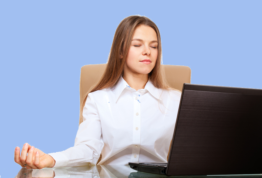 Woman meditating in her office