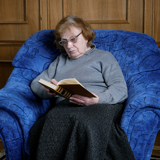 old woman reading a book