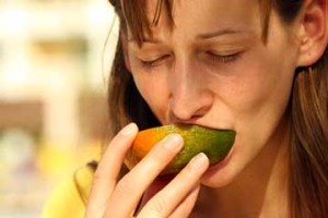 girl eating an orange